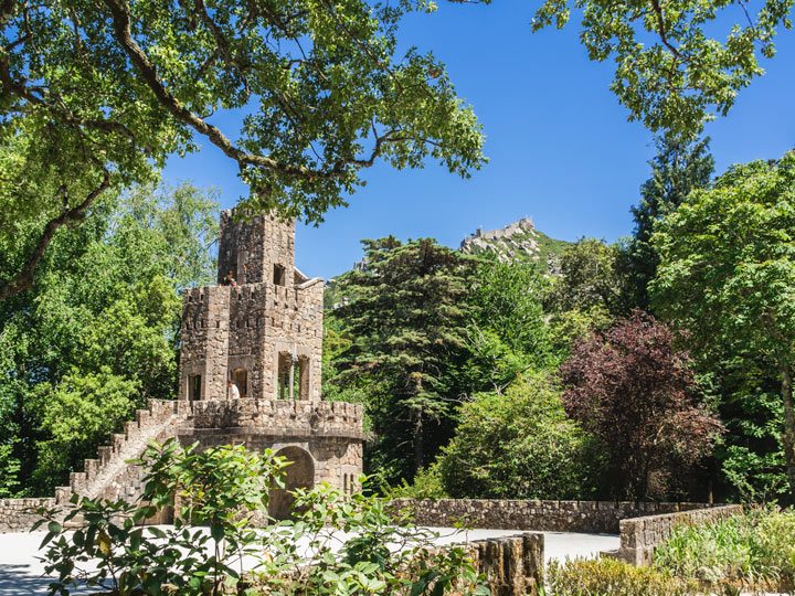 Quinta da Regaleira brick tower with view of Castle of the Moors