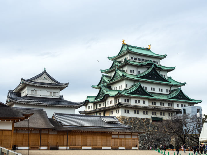 Nagoya Castle complex on a cloudy day.