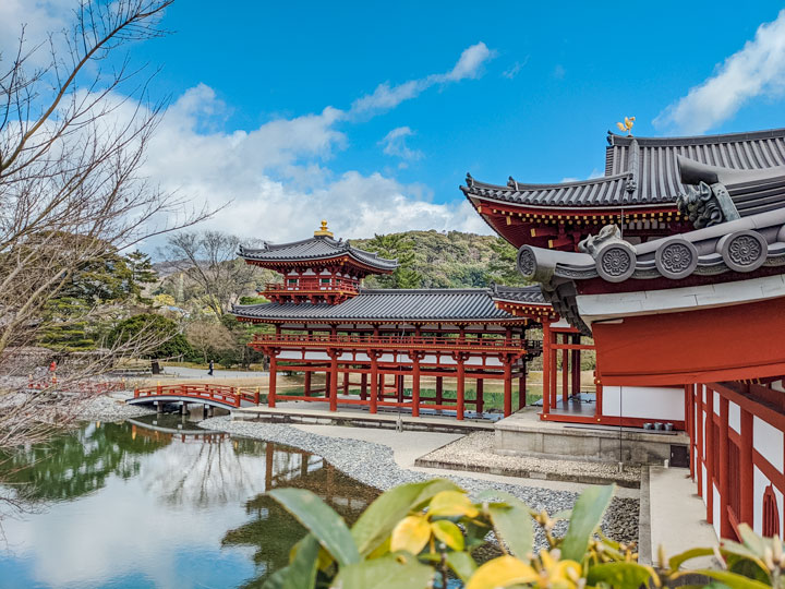 Uji Byodoin Temple exterior and pond with blue sky.