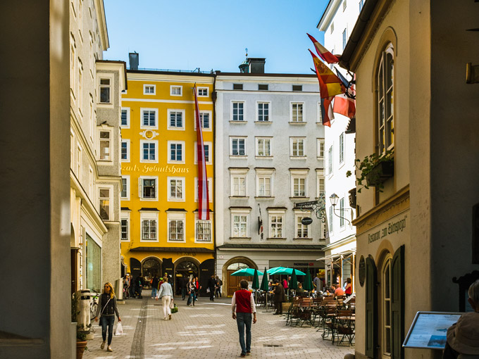 Yellow and white buildings of Mozartplatz, a popular place to visit during 2 days in Salzburg.