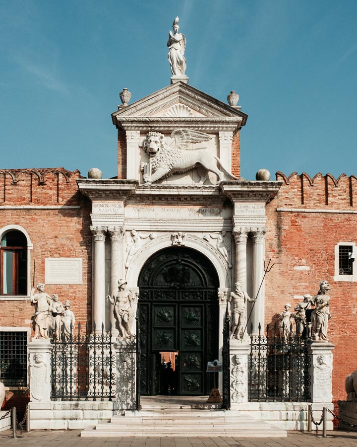 Front gate of Venetian Arsenal with statues and gryffon carving.