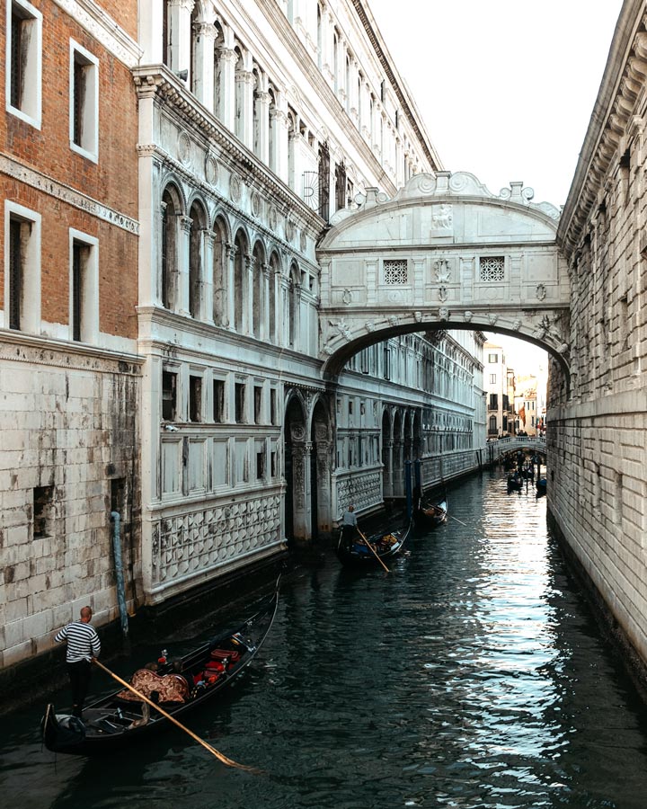 Venice Bridge of Sighs with gondolas passing along canal