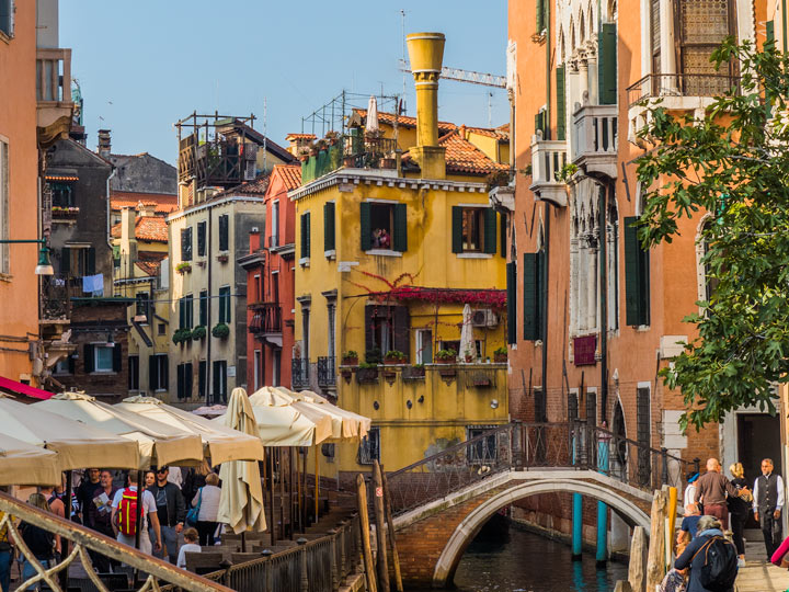 Colorful neighborhood buildings on canal spotted during 2 days in Venice itinerary.