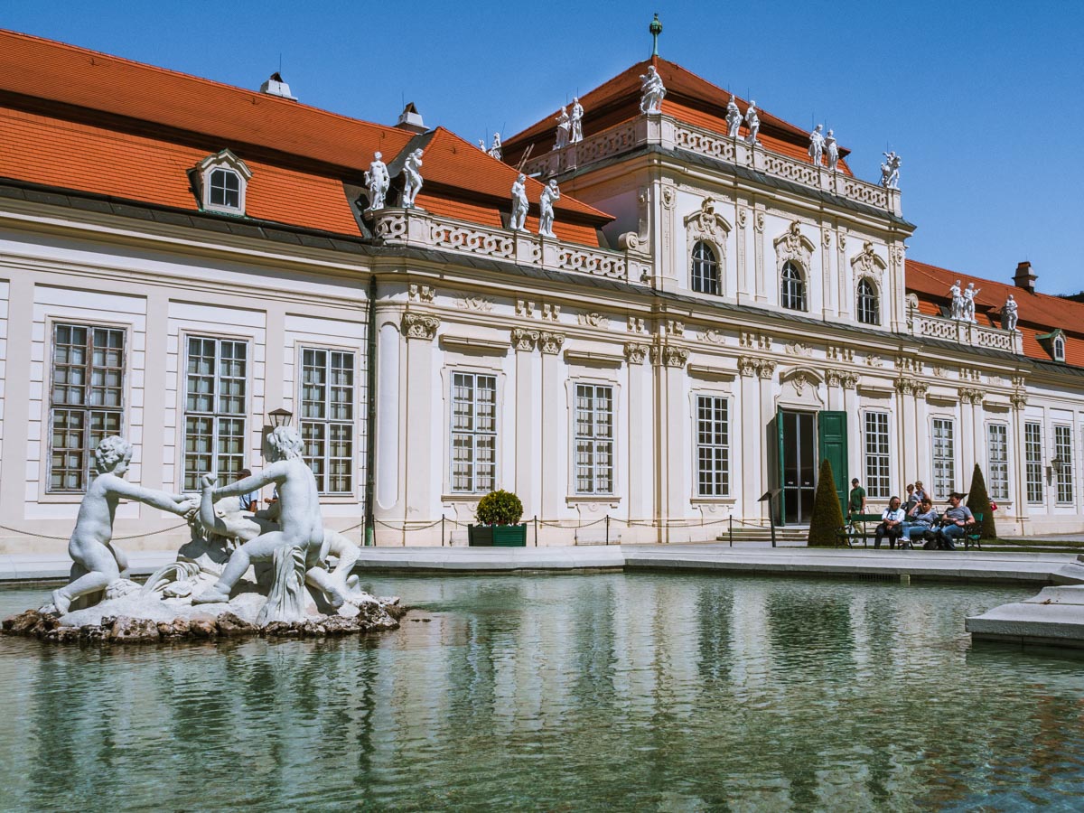 Water feature and statues outside facade of Belvedere Palace.