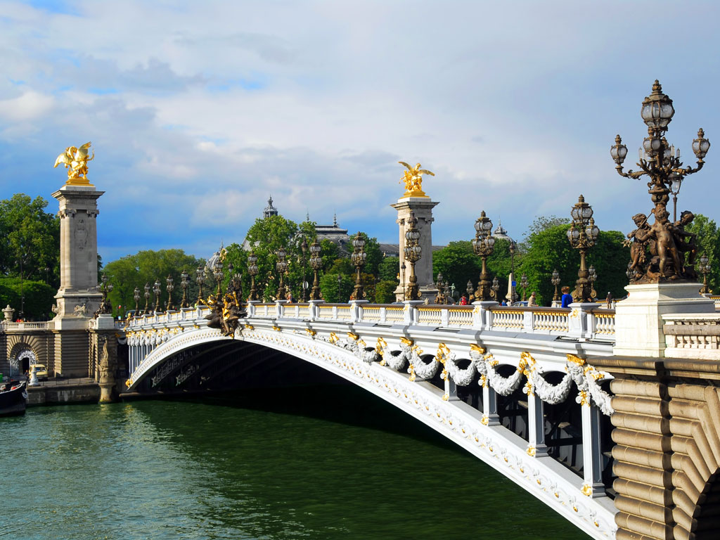 View of Pont Alexandre III bridge crossing the Seine river.