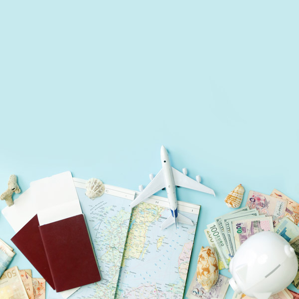 Moving abroad flat lay concept with plane, passport, map, and money