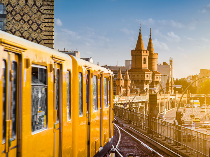 Berlin yellow tram car heading towards city center.