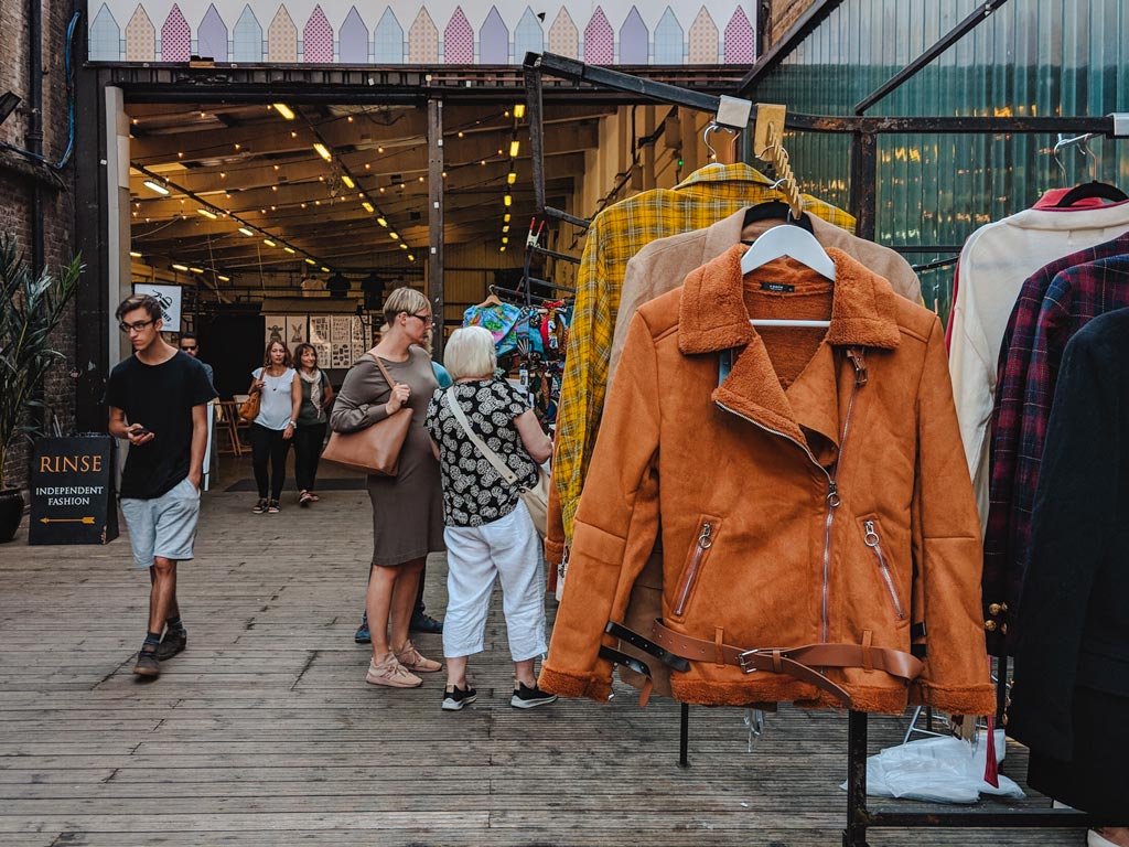 Racks of vintage jackets outside Brick Lane Vintage market in London.