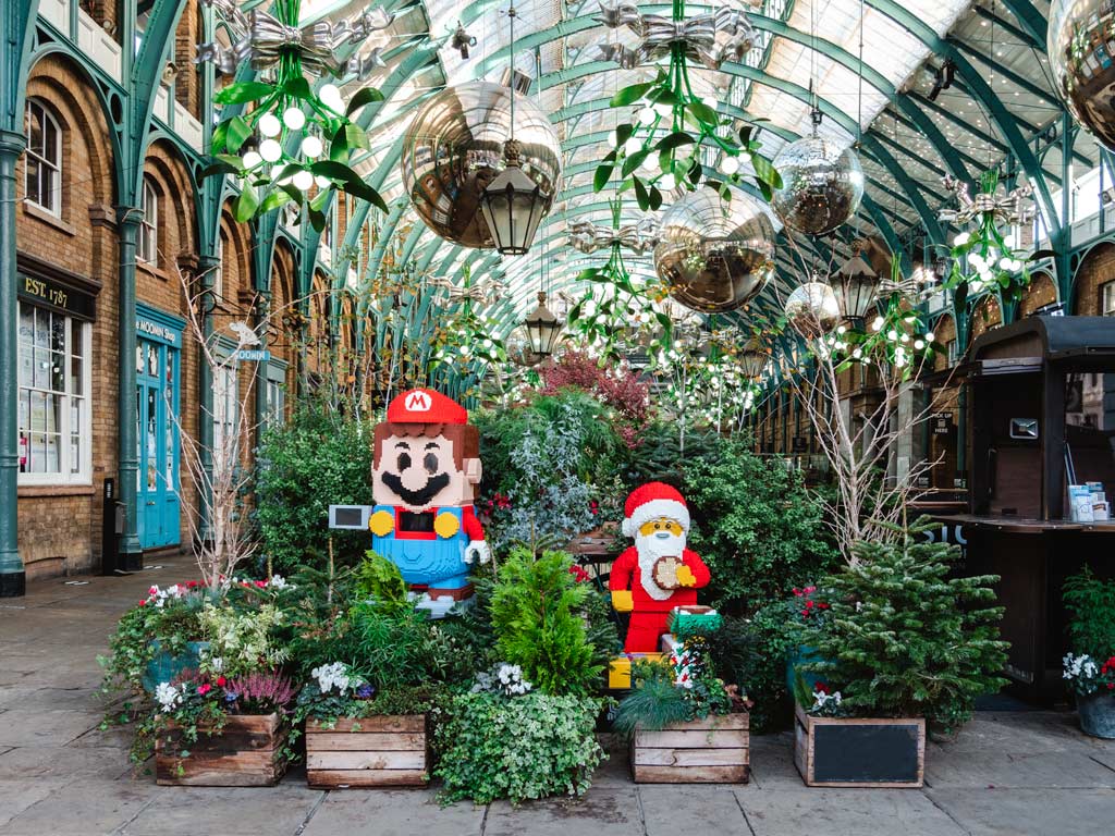 Holiday display with Mario and Santa Claus LEGO figures in Covent Garden, seen while shopping for best gifts from London.