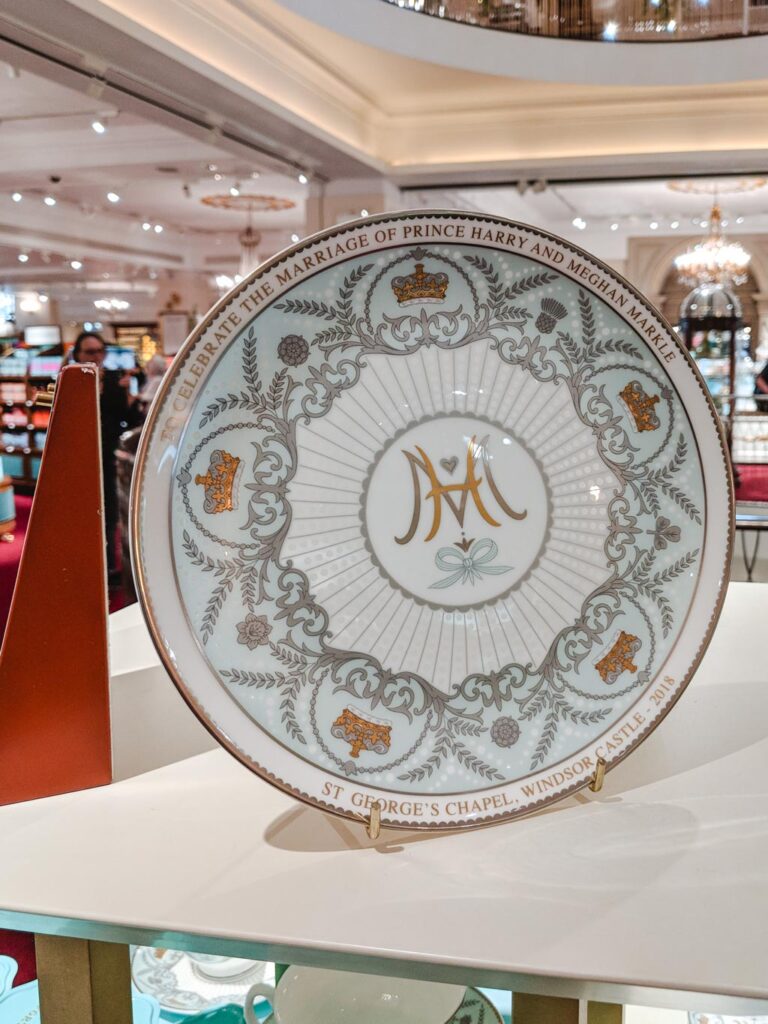 Blue and white tea saucer commemorating marriage of Prince Harry and Meghan Markle in Fortnum and Mason.