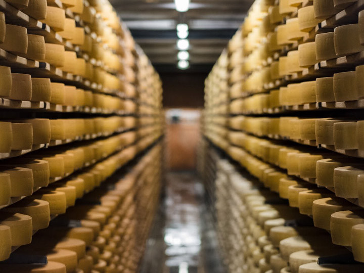 Vault with rows of cheese wheels in Gruyeres Switzerland.