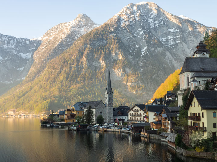 Panorama of Hallstatt Austria village houses with lake and mountain.