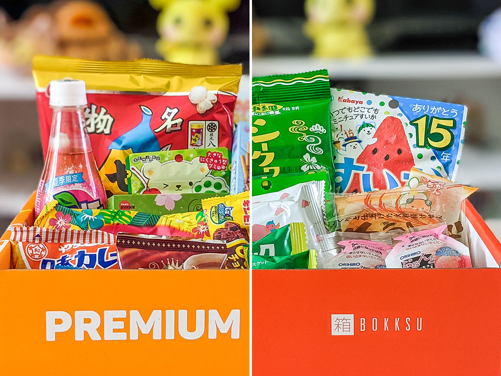 Split image showing Bokksu vs Tokyo Treat Japanese snacks inside orange boxes.