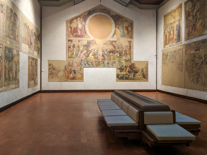 Roman fresco room inside Pinacoteca Nazionale, one of the top places to visit in Bologna.