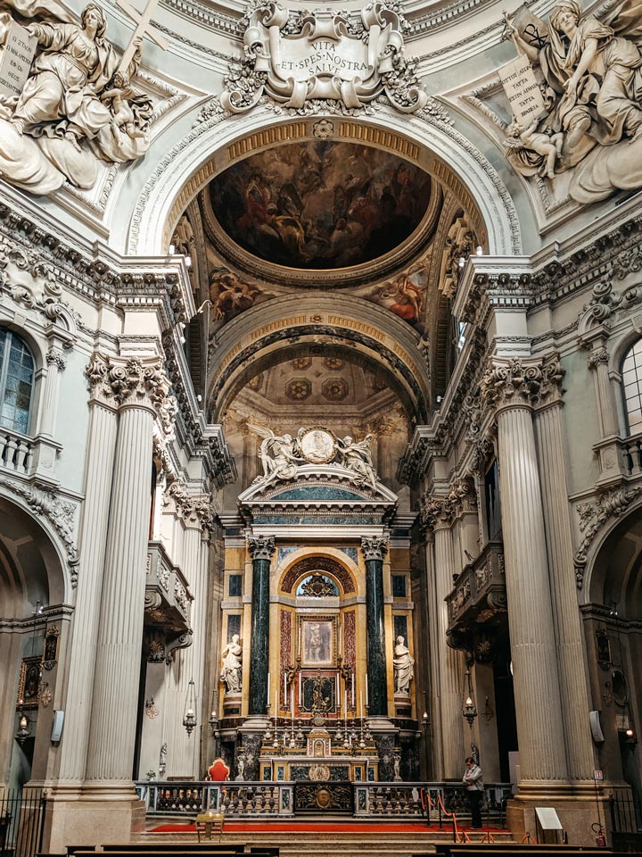 White marble carvings and fresco near altar of Santa Maria Della Vita.