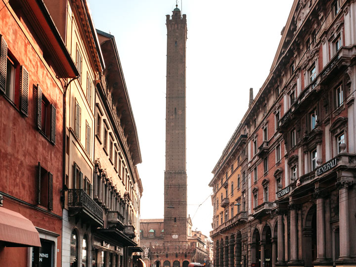 View down a street towards Asinelli Tower, one of the most popular places to visit in Bologna.