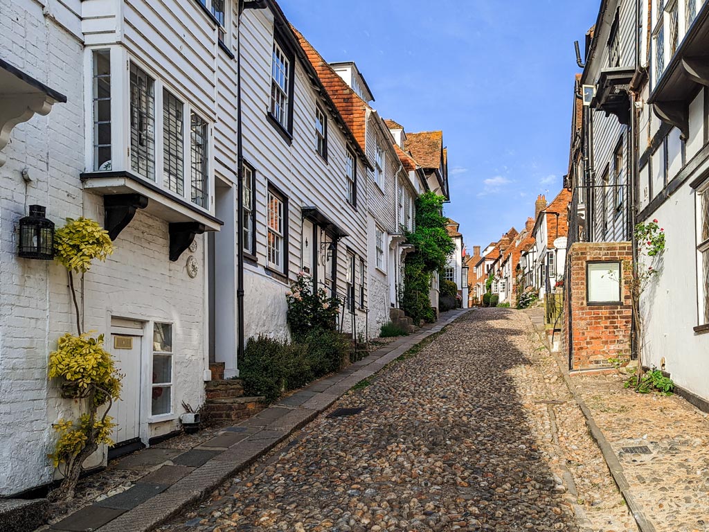 Cobbled alley of cottages viewed by person buying a house in the UK as an American.