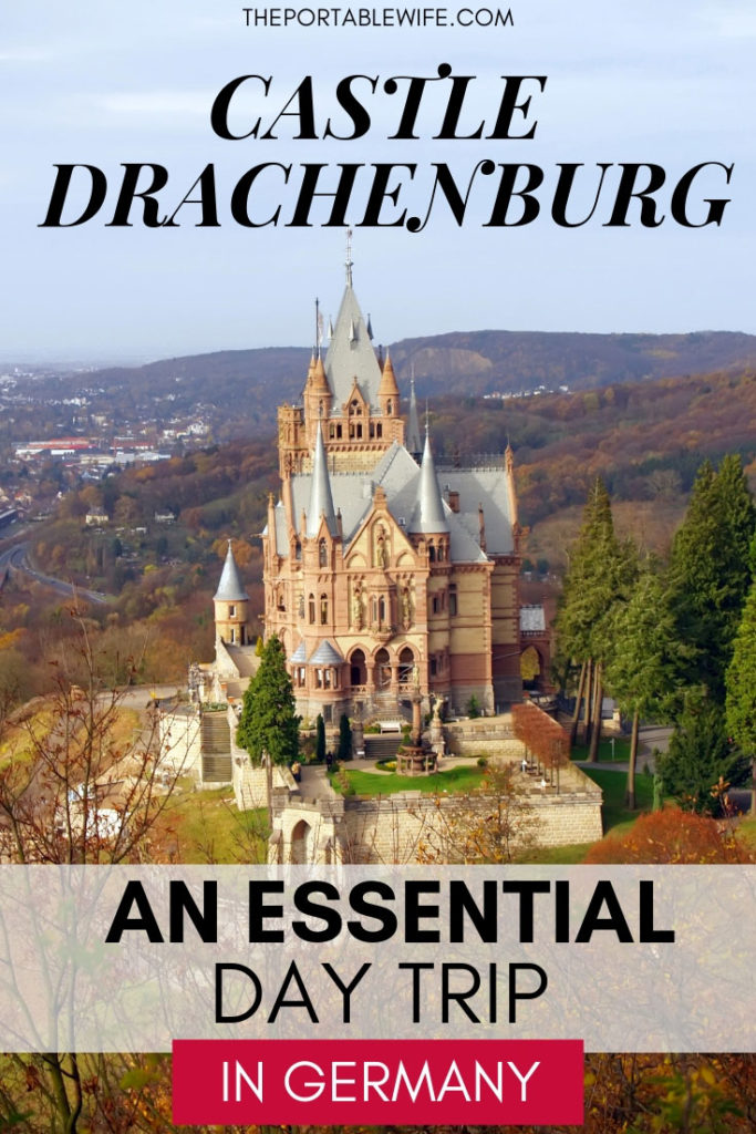 Aerial view of Castle Drachenburg on mountaintop, with text overlay - "Castle Drachenburg: An Essential Day Trip in Germany".