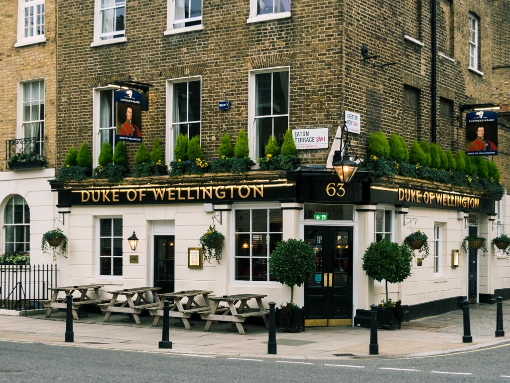 Brown brick exterior of Duke of Wellington pub where you can find cheap eats in London.