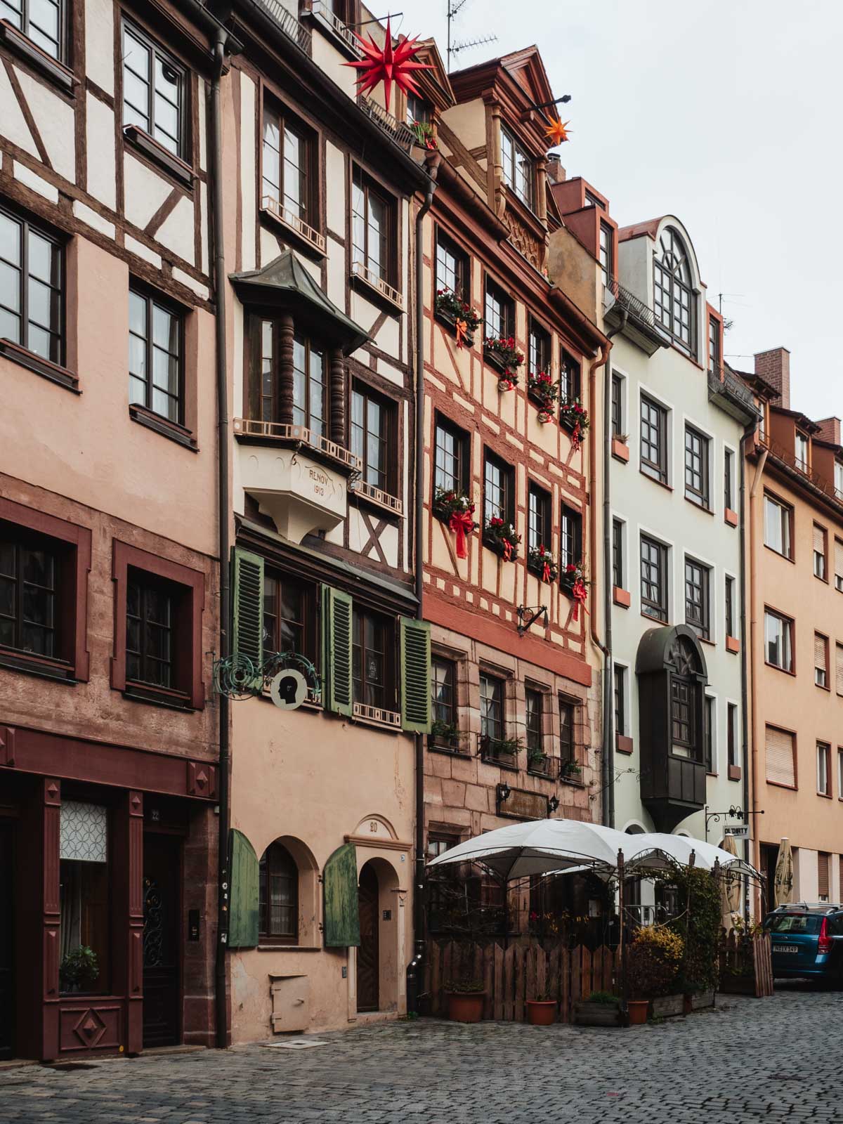 Nuremburg old town cobblestone street with half timbered buildings.