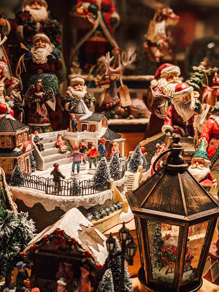 Snow globes and Santa decorations for sale during this Germany Christmas market itinerary.