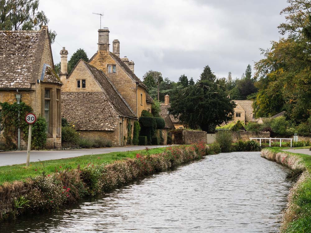 Cotswolds village houses on canal--living here drives up the cost of moving to the UK.