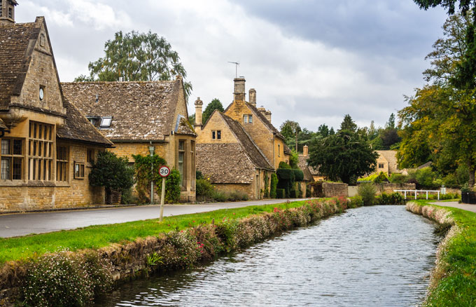 Lower Slaughter, one of the prettiest villages in the Cotswolds with stream running past cottages.