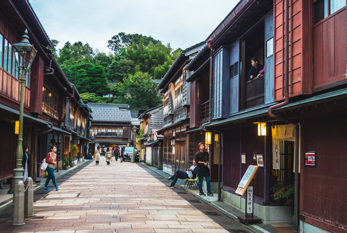 Historic Japanese street lined with traditional wooden buildings.