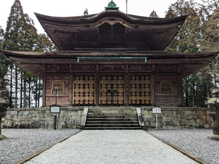 Enryaku-ji wooden temple with golden designs on door.