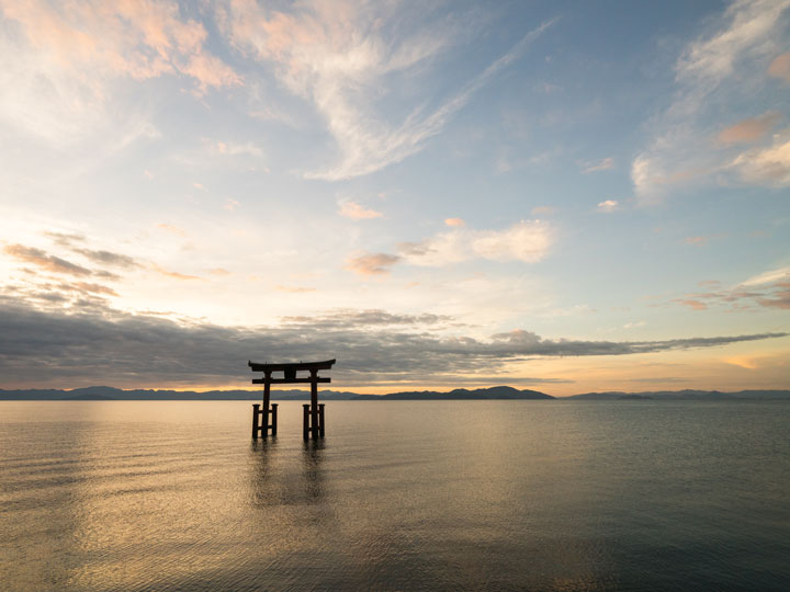 Lake Biwa floating torii gate at sunrise.