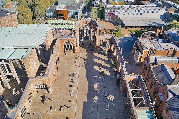 Overhead view of partially ruined large brick building.