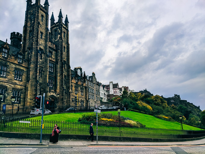 A moody day in Edinburgh in October with tall stone building in distance.