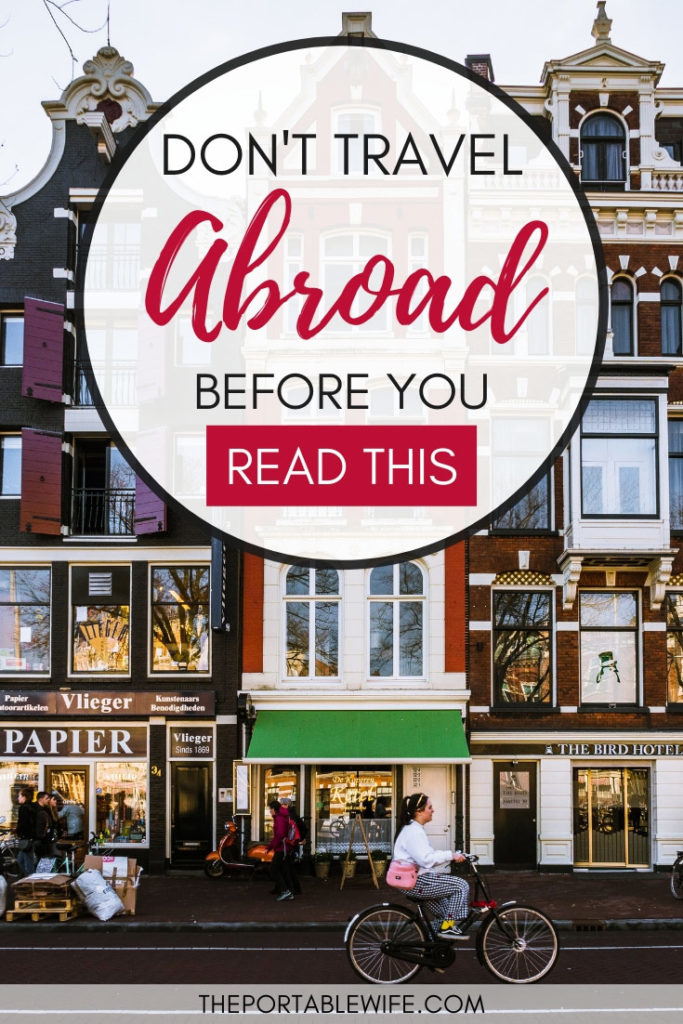 Buildings and busy street in Amsterdam, with text overlay - "Don't travel abroad before you read this travel terms and phrases".