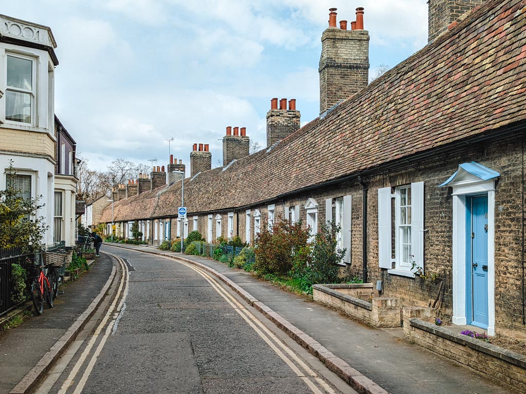 Row of brick cottages illustrating desirable property in the UK for expats.