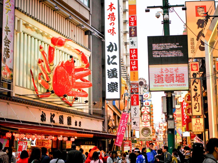 Osaka Dotonbori Street during busy afternoon with view of famous crab.