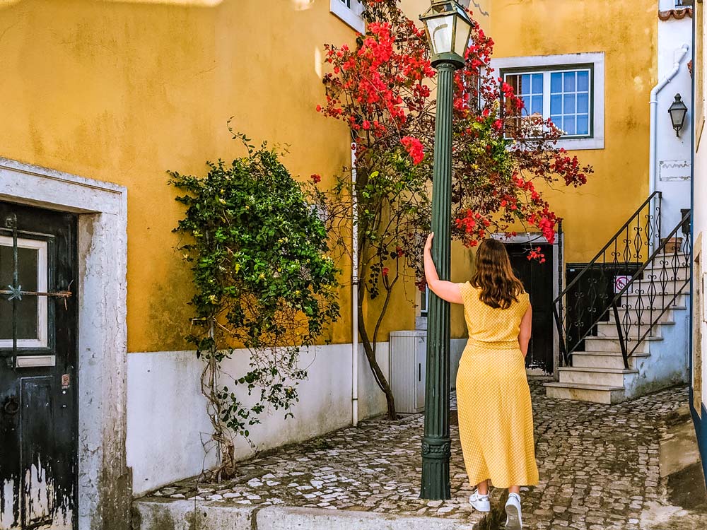 The Portable Wife standing next to lamppost in courtyard.