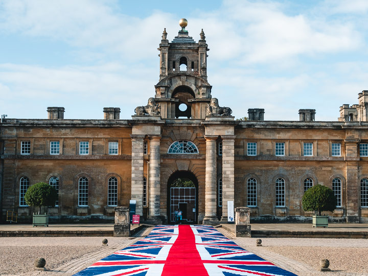 Blenheim Palace grand entrance with Union Jack flag runner leading to gate