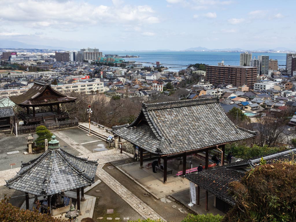 View of Mii-dera temple complex and city with Lake Biwa in distance.