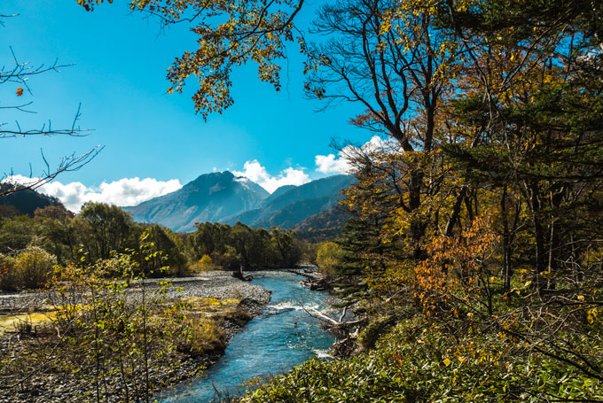 Kamikochi hiking in the fall next to river.