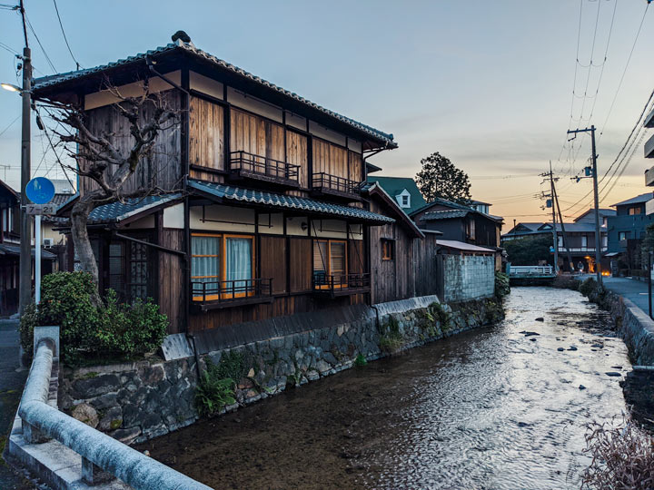 Traditional wooden Japanese house on canal in Kyoto.