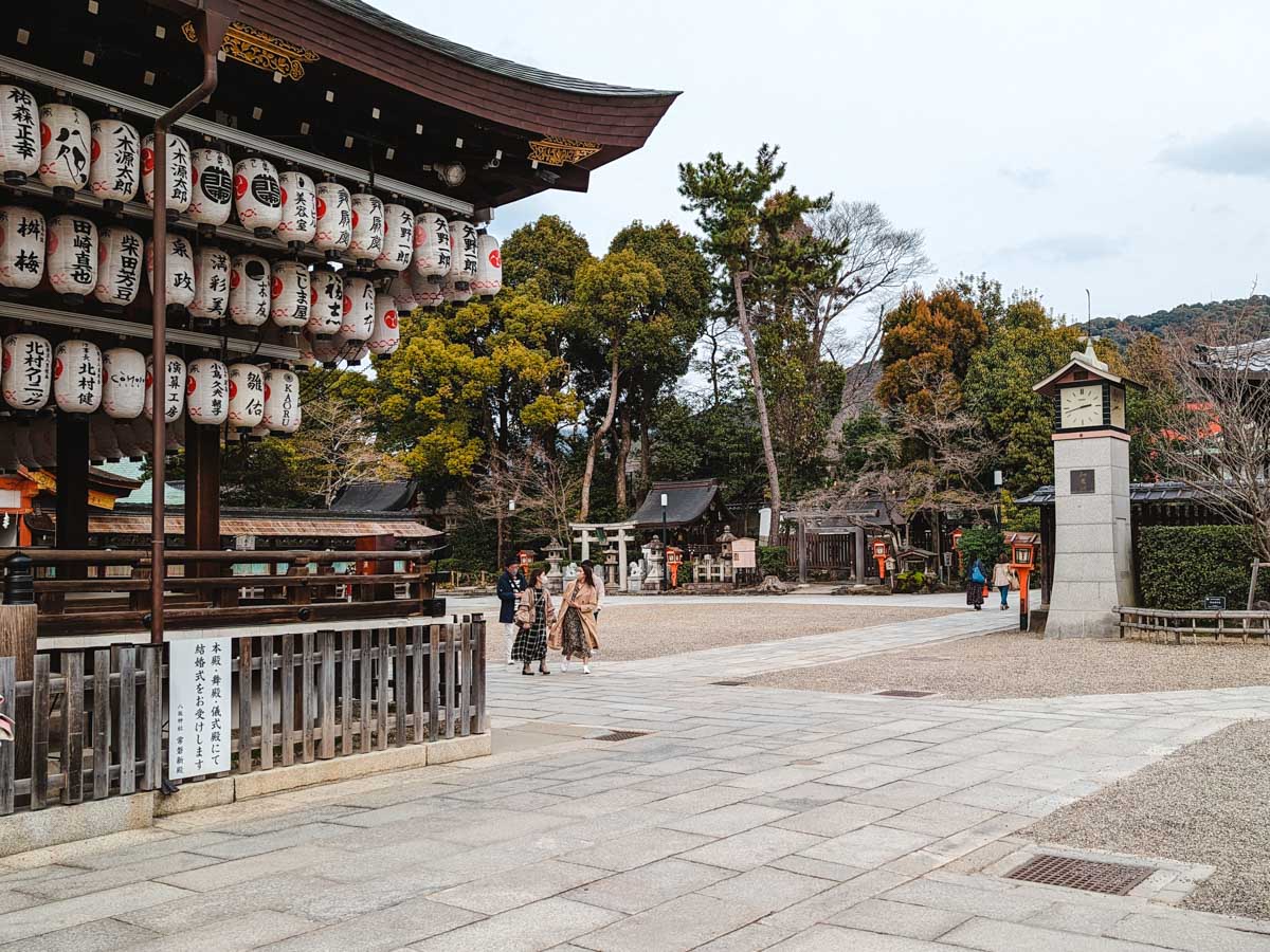 Inner grounds of Yasaka Shrine with lantern-filled temple.