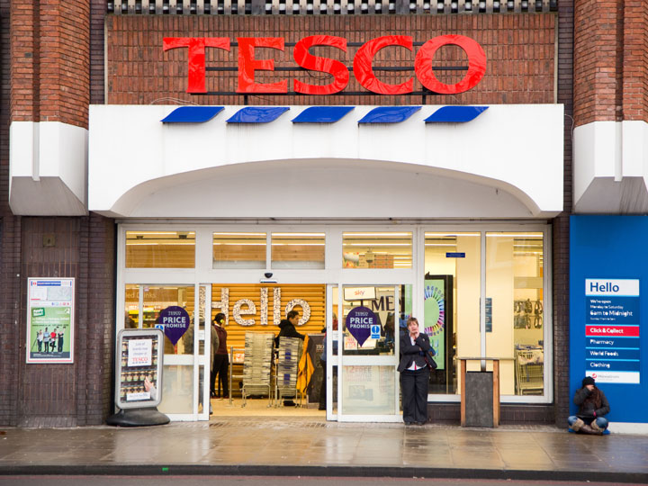 Front exterior doors of Tesco, the most popular of London grocery stores.