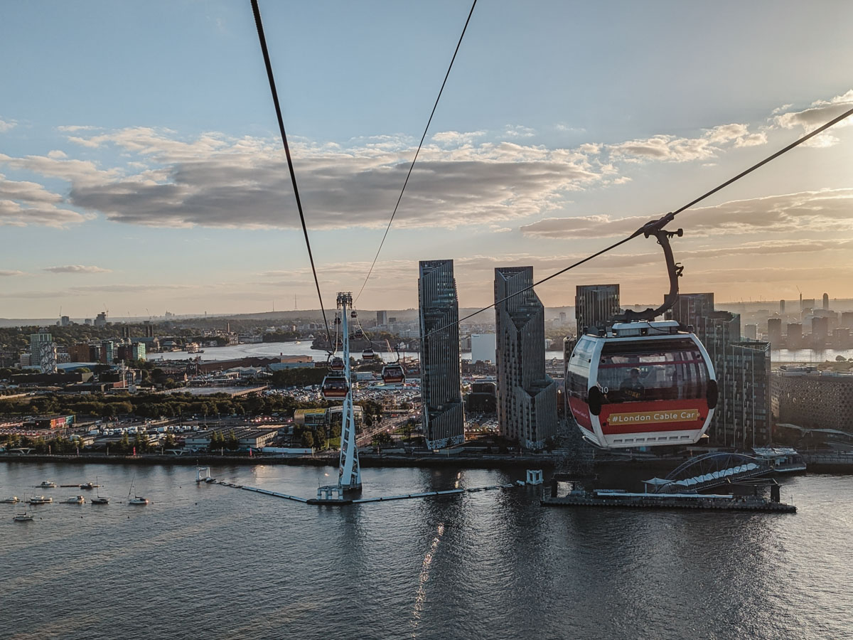 London Cable Car line going across river at sunset.