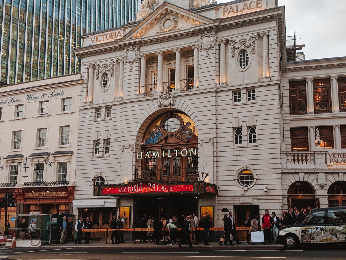 London Victoria Palace facade with "Hamilton" text over door.