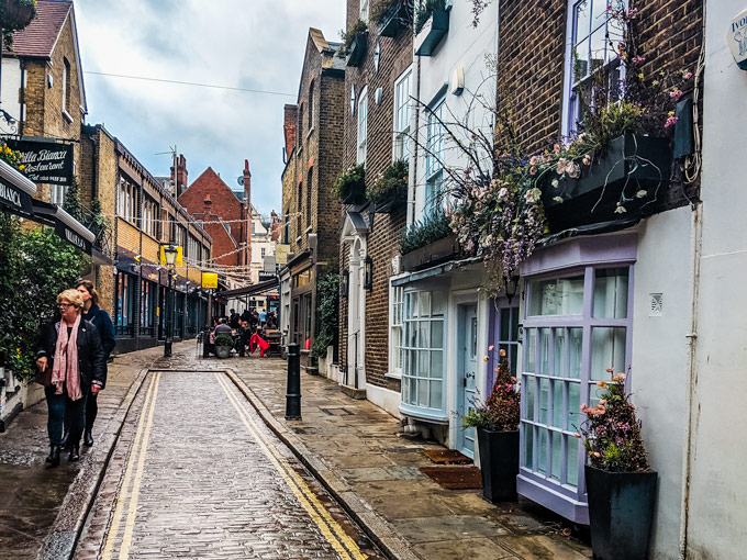 Perrin's Court in Hampstead London lined with old brick facades.