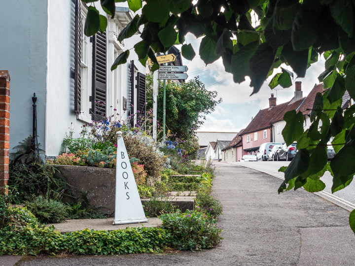 Sidewalk view of Books sign outside Debenham bookshop.