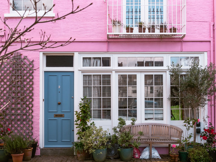 Expensive pink mews house with potted plants, a place that drives up the cost of living in London