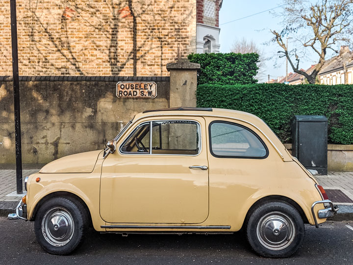 Vintage yellow car in London street