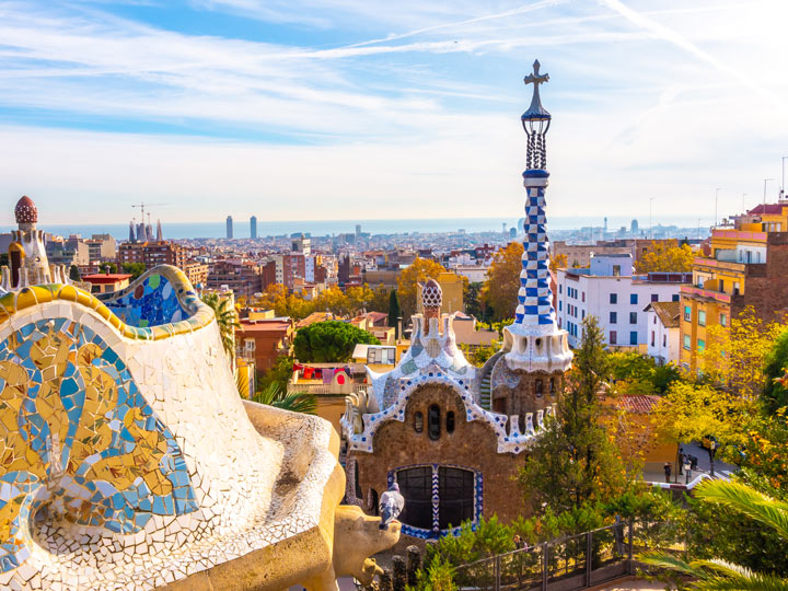 View of Parc Guell Barcelona with blue and white tower in distance.