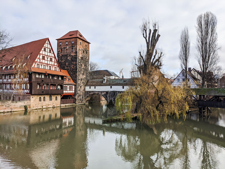 River, bridge, and half-timbered house in Nuremberg, one of the most Instagrammable places in Europe.